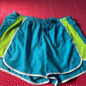 Shorts are blue and green. Brand is champion and size is small .